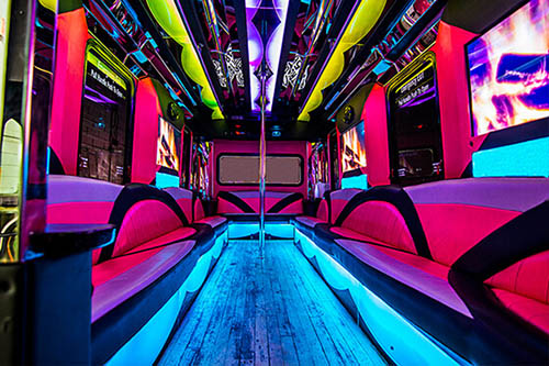 bright neon lights inside the pink bus